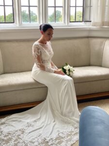 this is a photo of a woman on her wedding day holding flowers